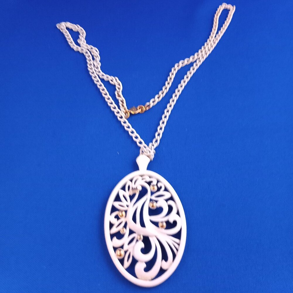 Vintage 1970s Monet white on gold bird of paradise pendant on white chain